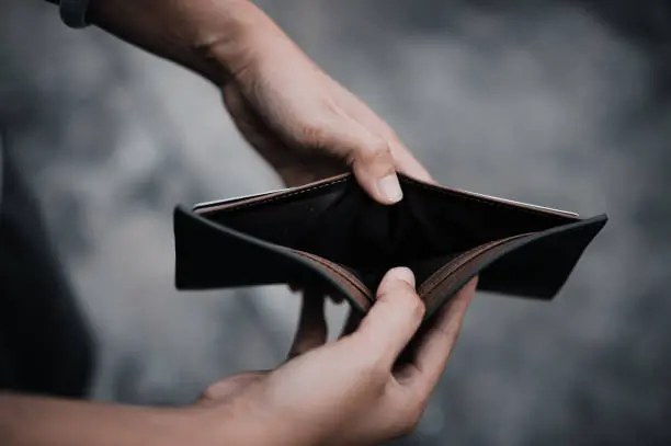 Empty money in wallet and unemployment concept.